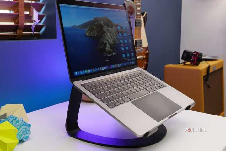 A MacBook Pro on a laptop stand. 