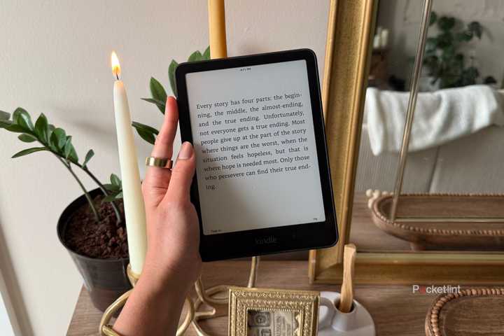 Kindle Paperwhite next to a candle.