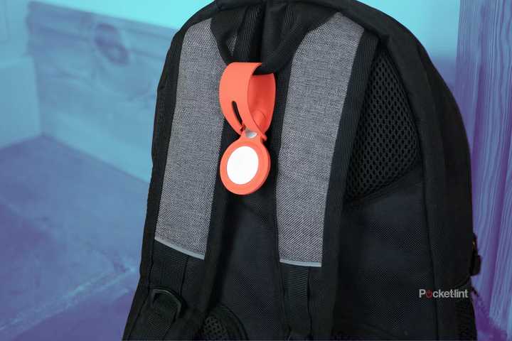 An AirTag attached to a backpack.