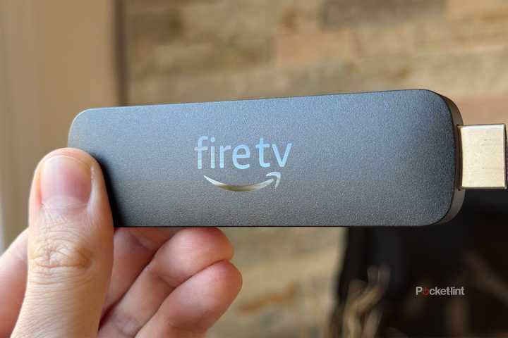 Person holding Fire TV Stick 4K Max.
