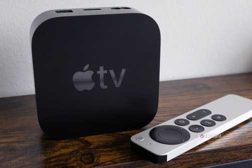 Apple TV 4K and remote on table.