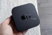 Person holding Apple TV 4K.