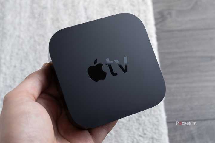 Person holding Apple TV 4K.