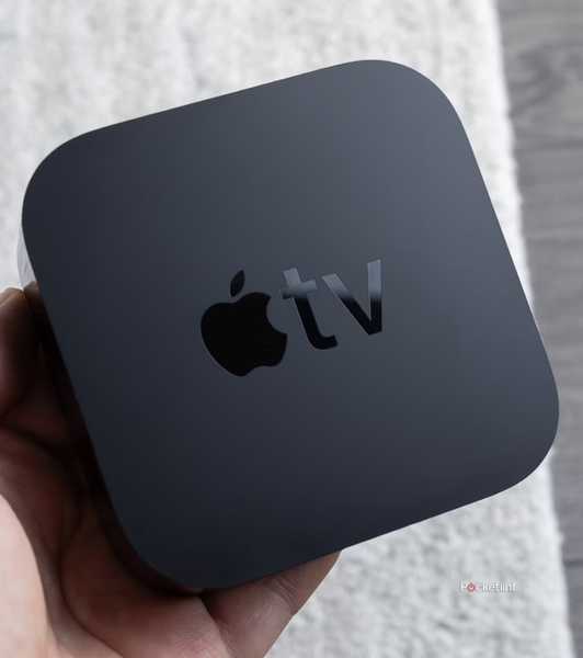 Person holding Apple TV 4K.
