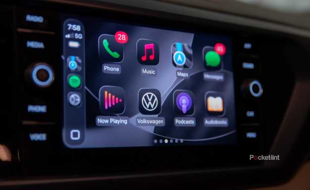 A still photo of Apple CarPlay iOS 26 with apps in dark mode. 