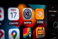 A still photo of the Apple CarPlay screen with the Audible app in focus. 