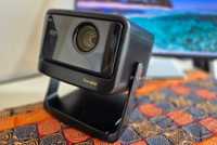 Dangbei DBOX02 Pro Projector on a table. 