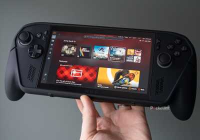 The ROG Xbox Ally X Killswitch case being held in front of a green wall 