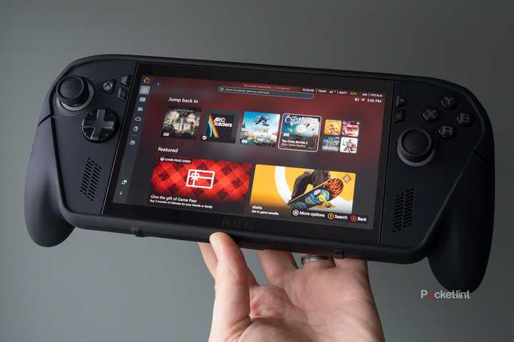 The ROG Xbox Ally X Killswitch case being held in front of a green wall 