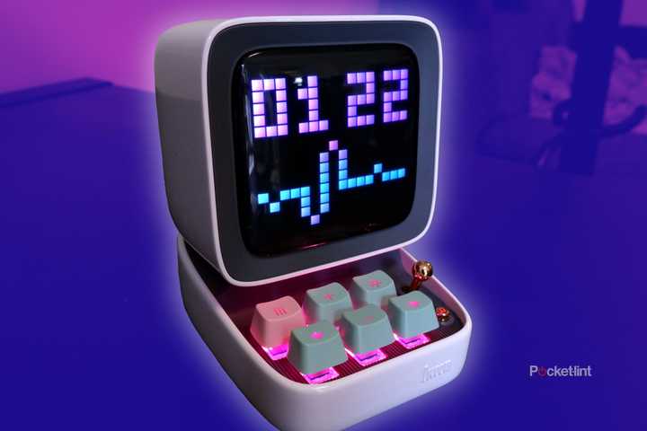 The Divoom Ditoo bluetooth speaker on a shelf, with an edited purple background