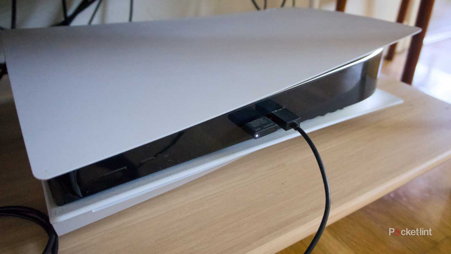 An InZone H9 II dongle plugged into a PS5.