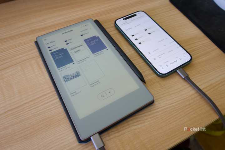 A reMarkable Paper Pro Move connected to an iPhone 16 with a USB-C cable.