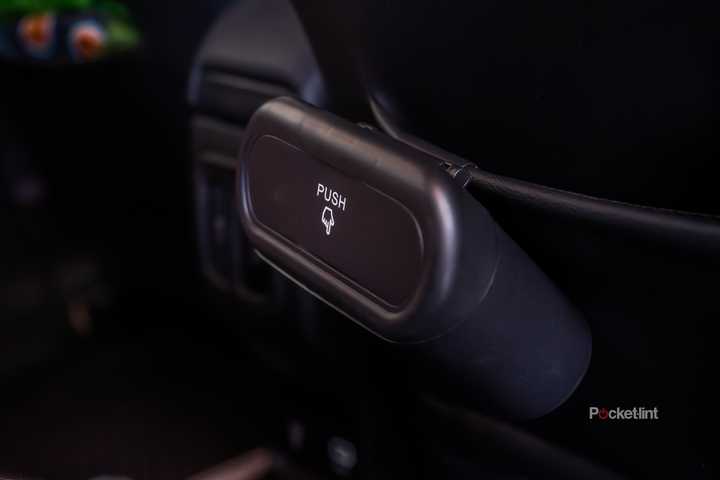 A still photo of the Accor car trash can in the back seat of a Jeep. 