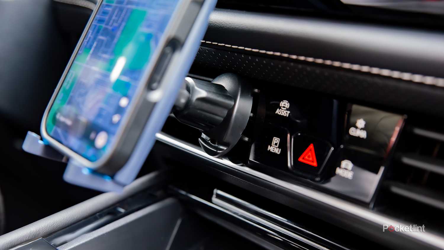 A still photo of a Lounge-IT phone mount connecting to an A/C vent. 