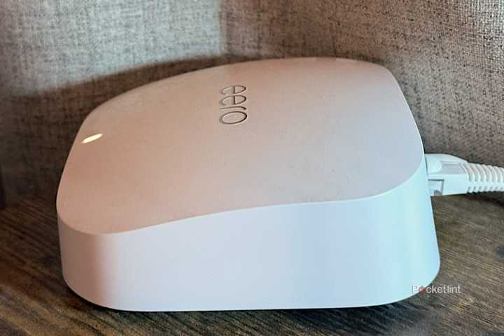 An Eero Pro 6E Wi-Fi router on a desk.