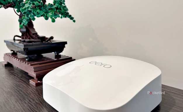 An Eero Pro 6E next to a Lego bonsai tree.