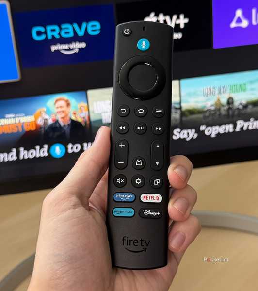 Fire TV remote in front of TV.
