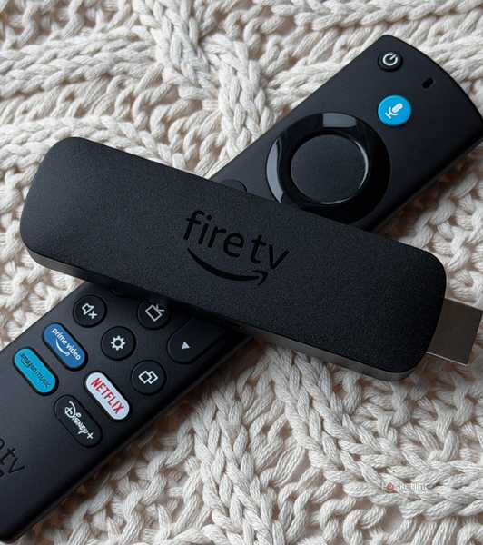 Fire TV Stick and Fire TV remote on knit pillow.