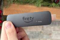 Person holding Fire TV Stick 4K Max.