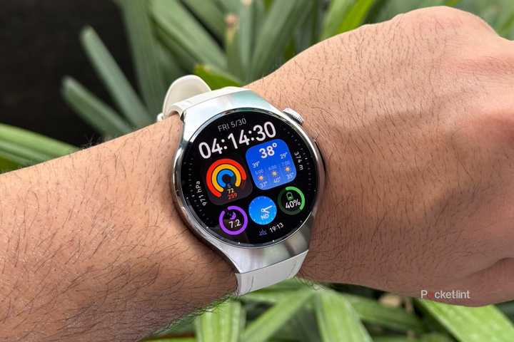 Huawei Watch 5 on wrist with watch face showing things like time, sleep data, weather, and activity rings