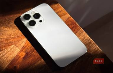 iPhone 16 Pro in White Kept on a Wooden Table