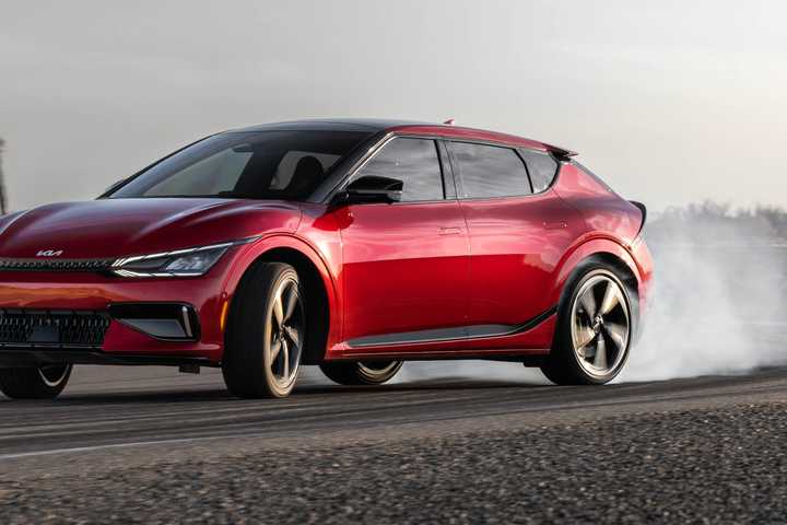 Red Kia EV6 SUV showing it power.