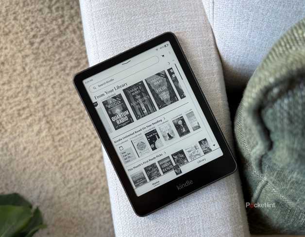 A Kindle Paperwhite on a sofa. 