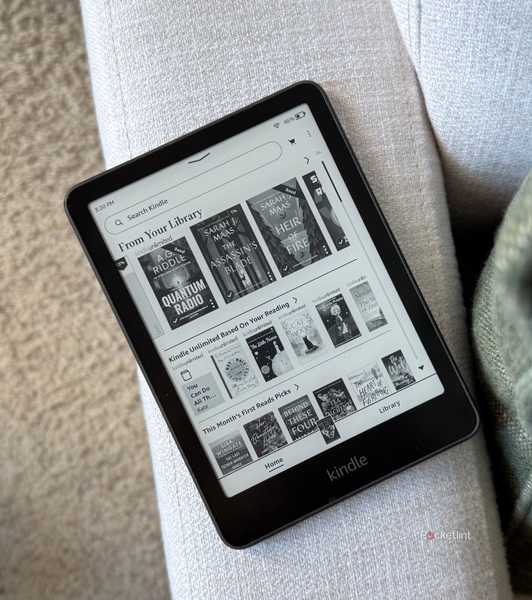 A Kindle Paperwhite on a sofa. 