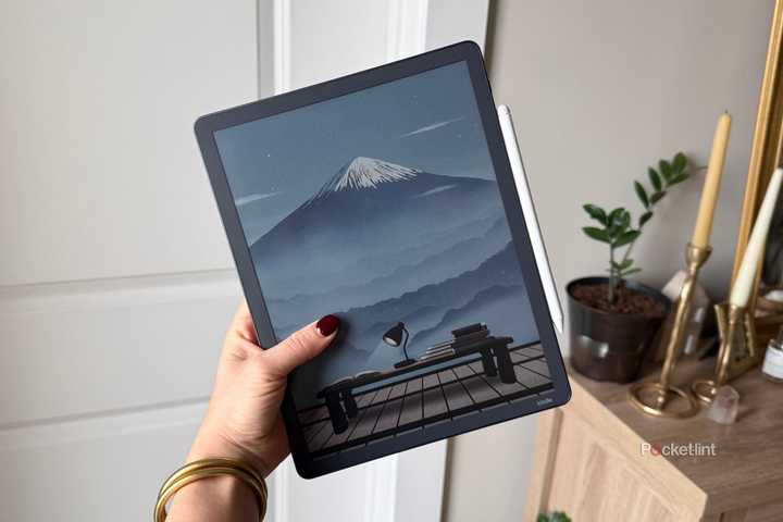 The Kindle Scribe Colorsoft with a mountain. 