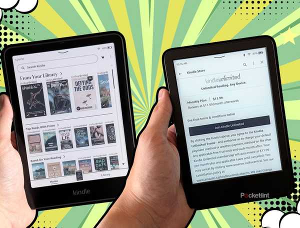 Two Kindles in hand. 