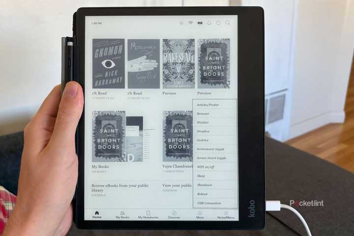 A hand holding a Kobo Elipsa 2E displaying NickelMenu in the bottom right corner.