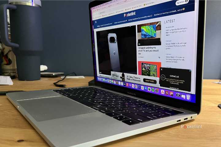 An open MacBook Pro with its side ports showing.