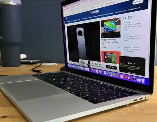 An open MacBook Pro with its side ports showing.