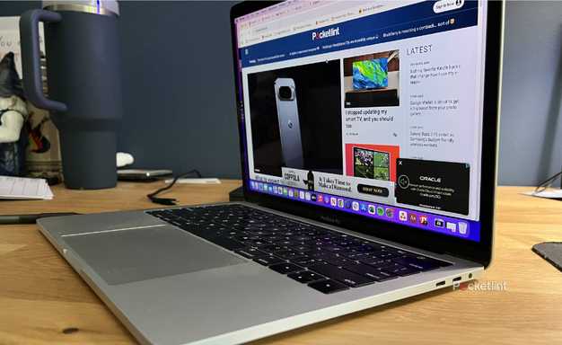 An open MacBook Pro with its side ports showing.