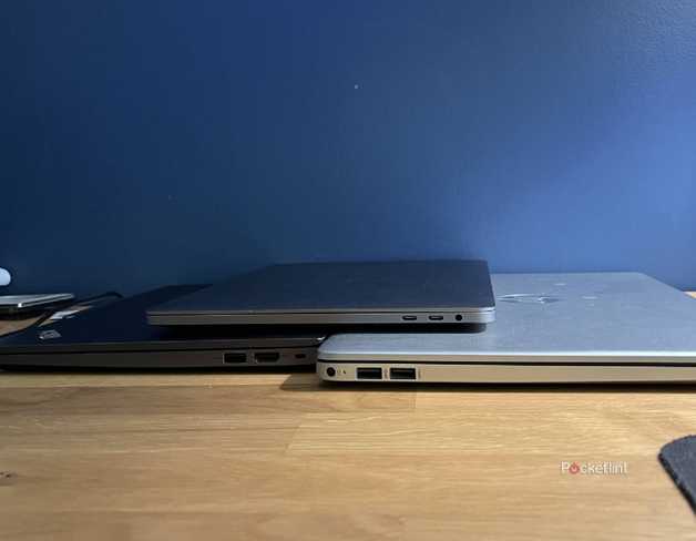 Lenovo, MacBook, and HP laptops showing their USB ports.