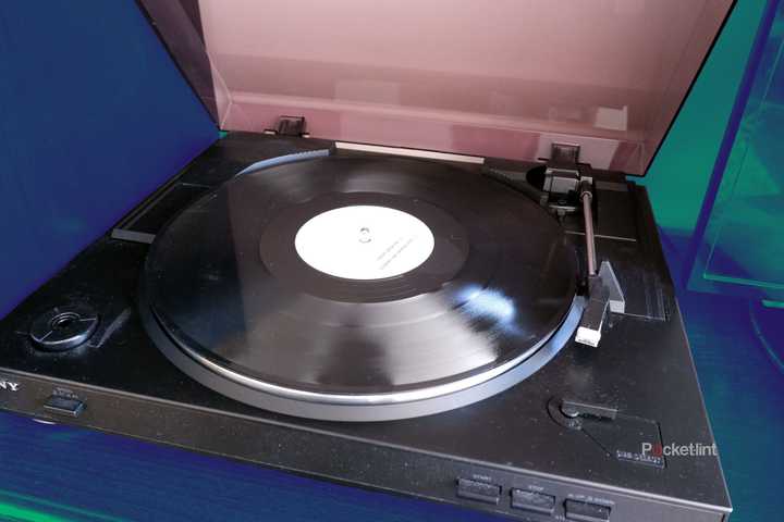 A Sony record player with a record on the turntable, with the lid open.