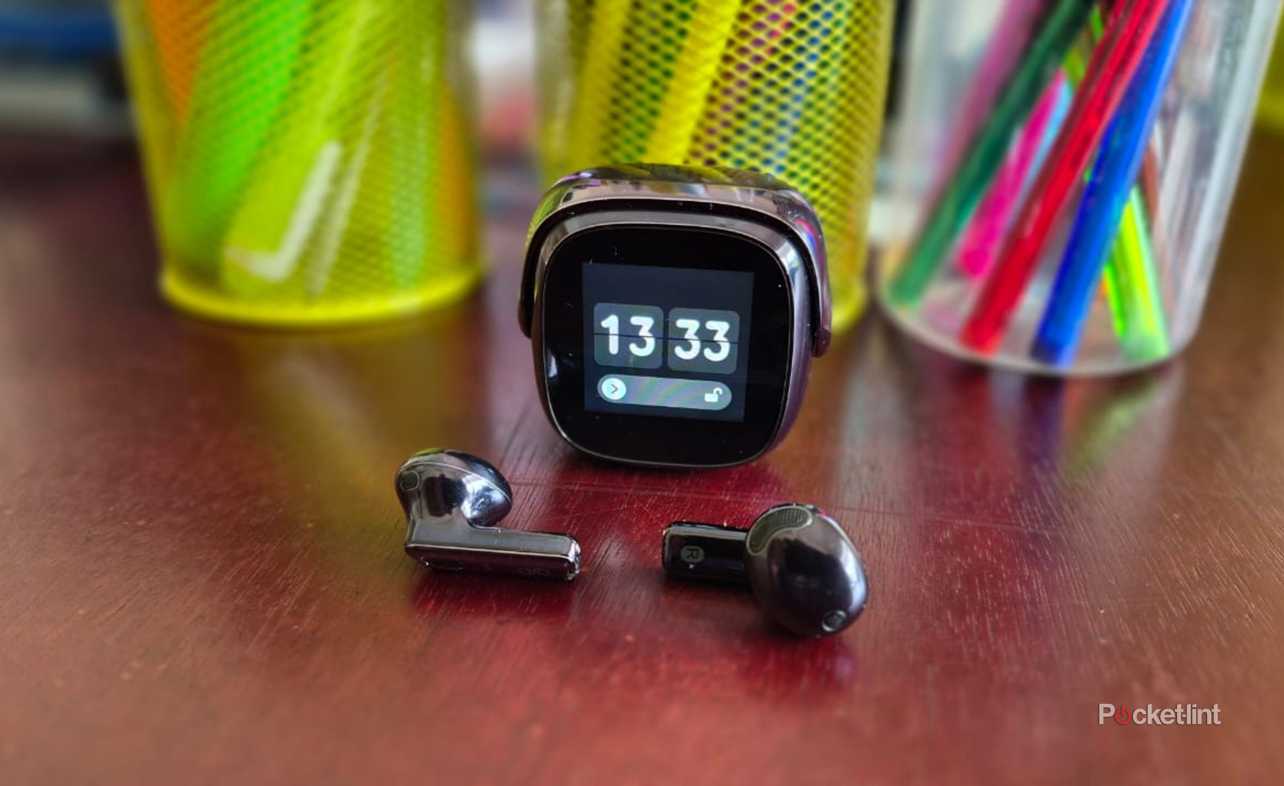 OSO AI Earbuds box and charging case on a table side