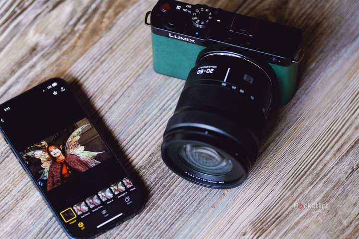 A photo of the Panasonic S9 with an iPhone and the Lumix Labs app