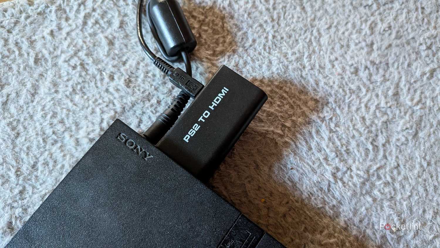 The PS2-to-HDMI adapter in a PS2
