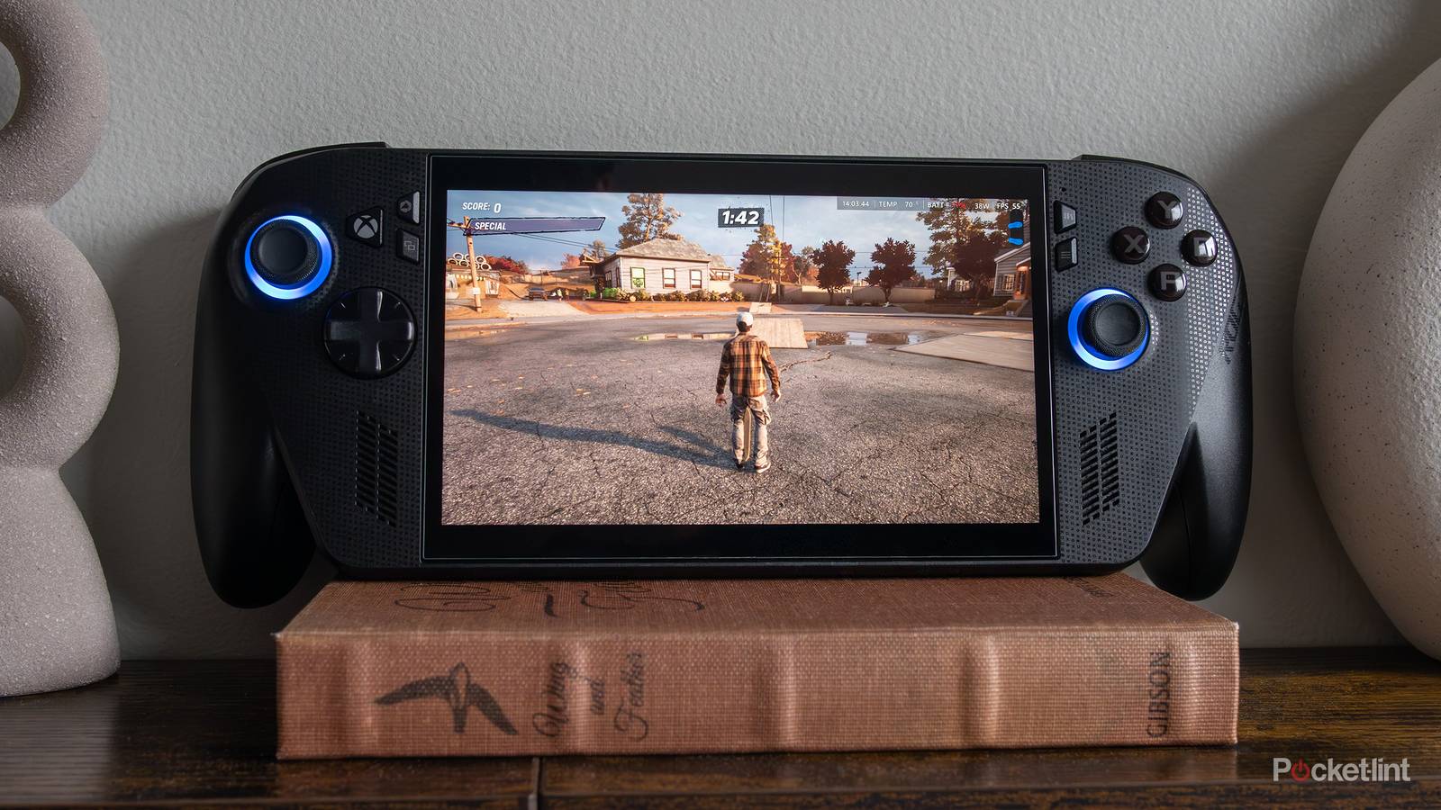 The ROG Xbox Ally X sitting on a book