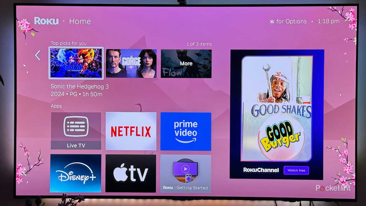 Roku OS home page with pink wallpaper