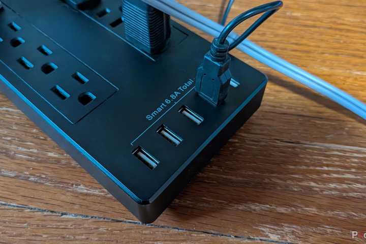 A photo of a power strip with four USB ports.