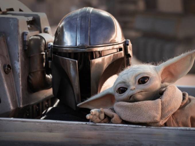 The Mandalorian with Grogu in a screenshot from the show