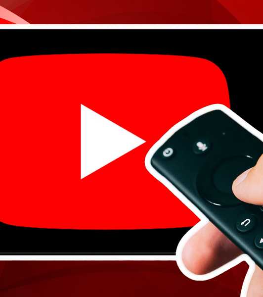 Person holding TV remote in front of TV with YouTube app on it.