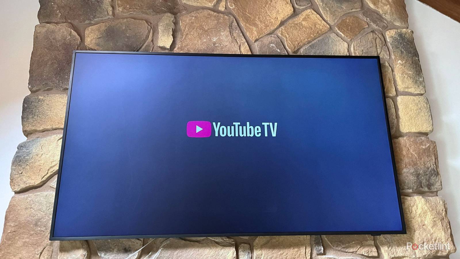 YouTube TV on a mounted TV. 